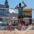 3 Männer spielen vor einem Publik am Forum Allgäu Beachvolleyball.
